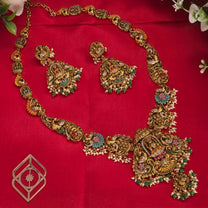 Long necklace, set with enamel paint. Lakshmi and peacock motifs. Ahankaraka AKLN04.
