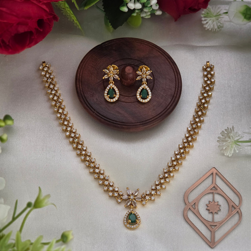 Short necklace, set with American Diamond stones and emerald, floral motif. Ahankaraka AKSN40.