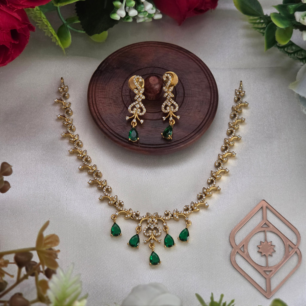 Short necklace, set with American Diamond stones and emerald, peacock motif. Ahankaraka AKSN37.