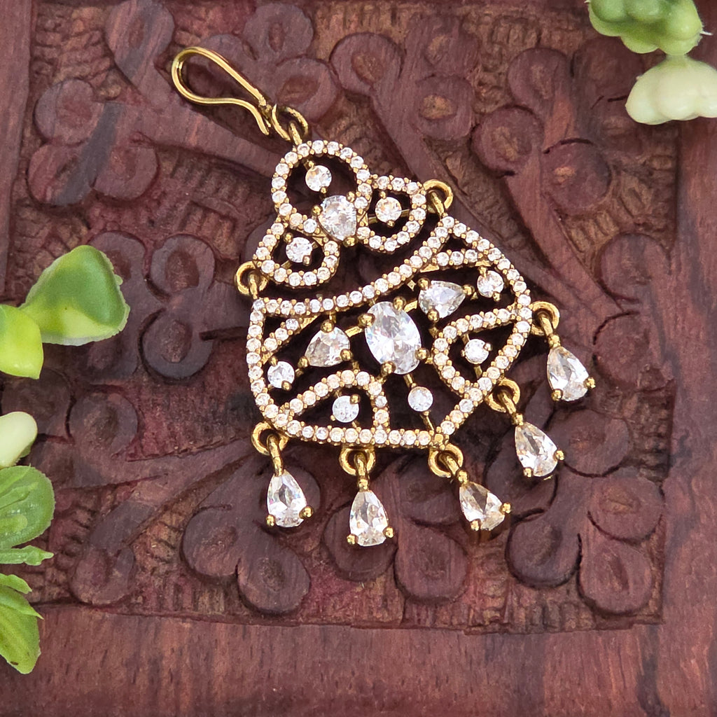 Maang tikka, set with American Diamond stones and white stones. Ahankaraka AKMT26.