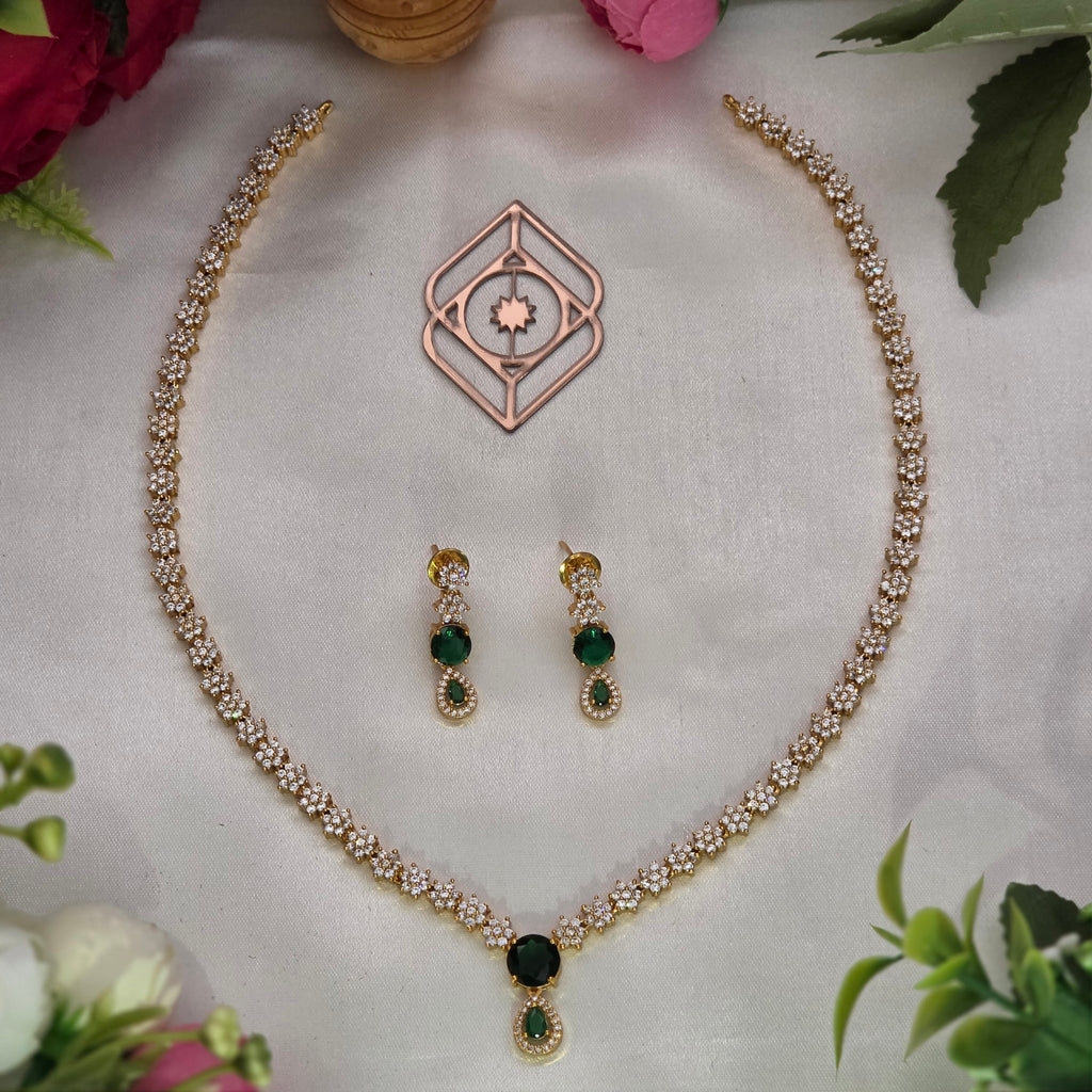 Mid length necklace, set with American Diamond stones and emerald, floral motif. Ahankaraka AKMLN16.