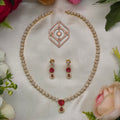 Mid length necklace, set with American Diamond stones and ruby, floral motif. Ahankaraka AKMLN15.