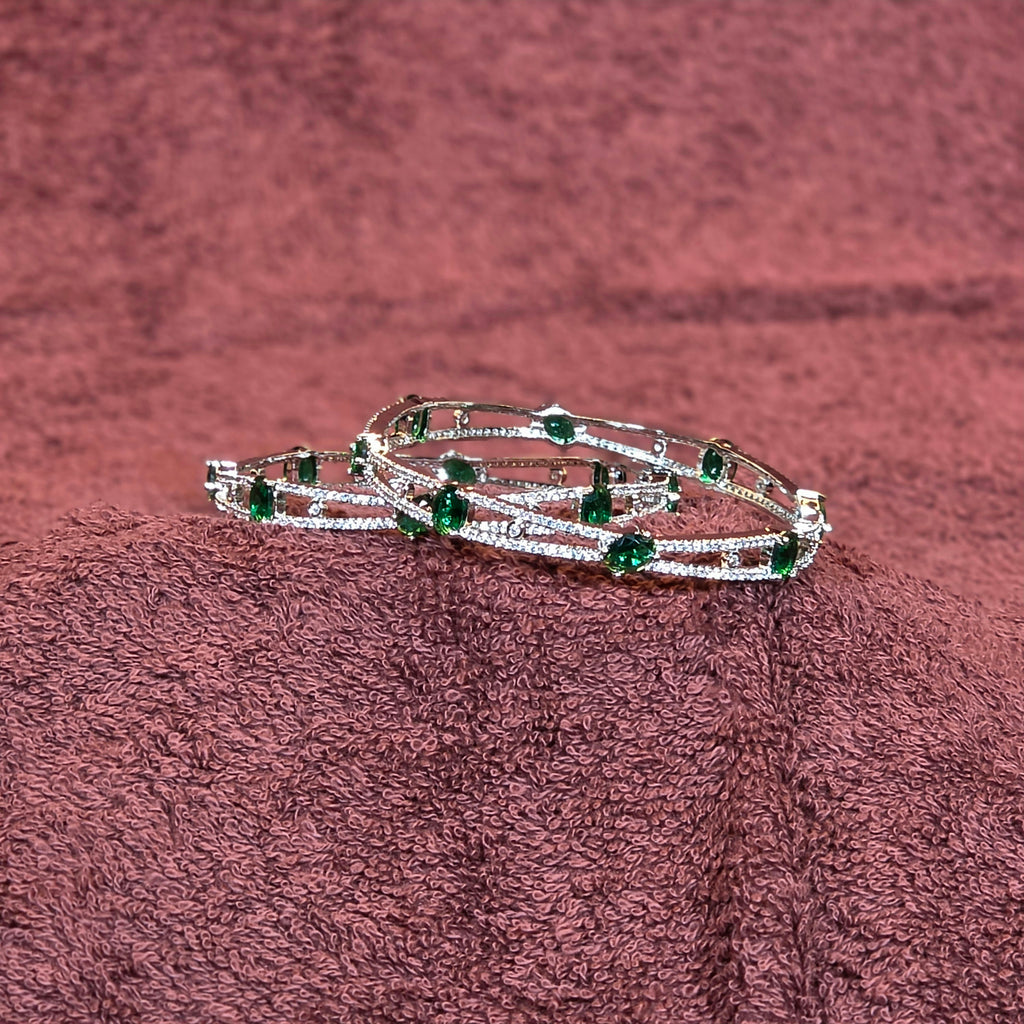 Bangles, set with emerald and white stones. Ahankaraka AKBA51.