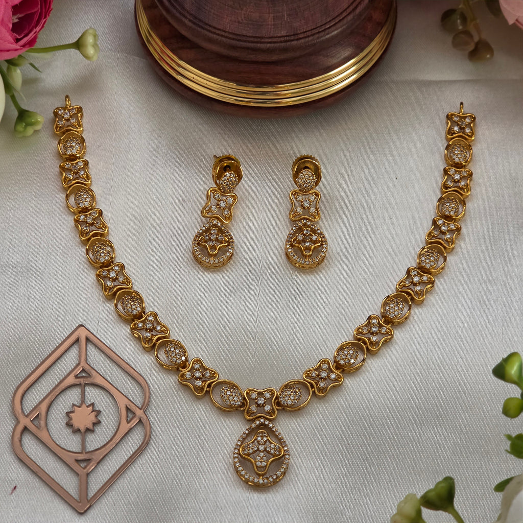 Short necklace, set with American Diamond stones, floral motif. Ahankaraka AKSN44.