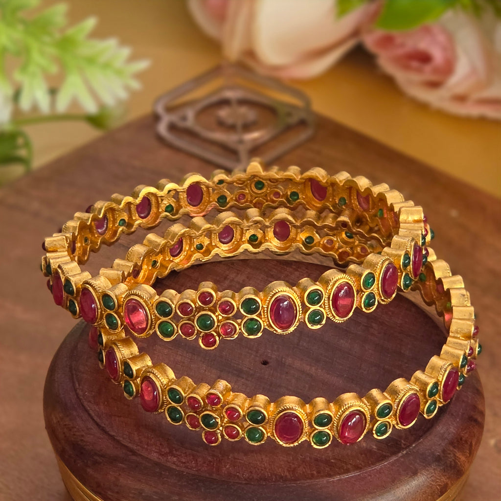 Bangles, set with kemp, floral motif. Ahankaraka AKBA80.