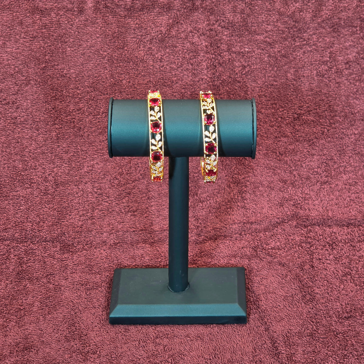 Bangles, set with ruby-toned stones and leaf motif. Ahankaraka AKBA05.
