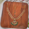 Maang tikka, set with kemp and green beads, floral motif. Ahankaraka AKMT05.