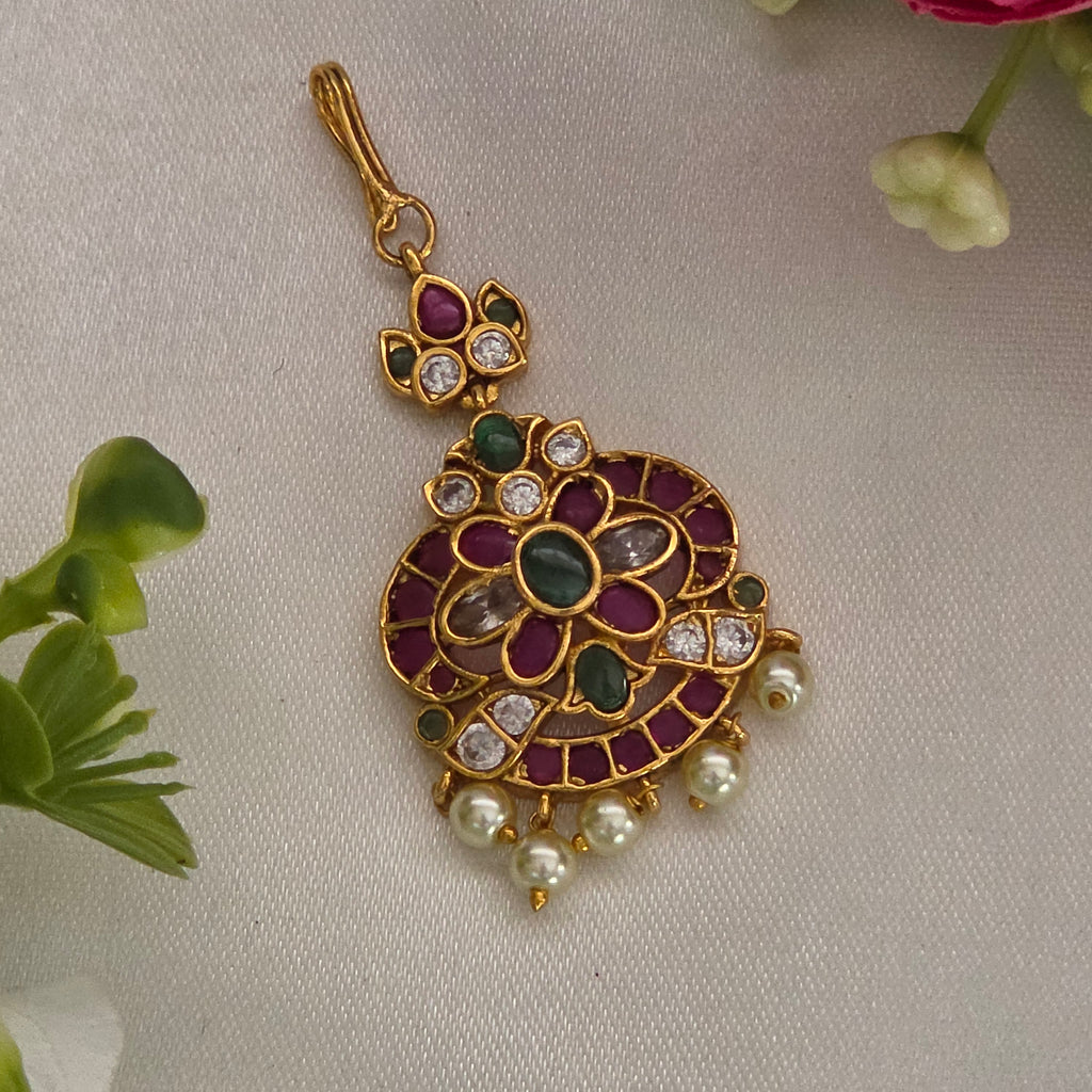 Maang tikka, set with kemp and pearls, peacock and floral motifs. Ahankaraka AKMT28.