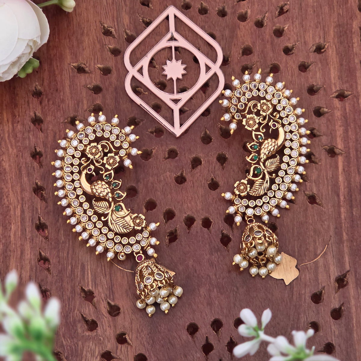 Ear cuff, set with American Diamond stones, peacock motif. Ahankaraka AKEC14.