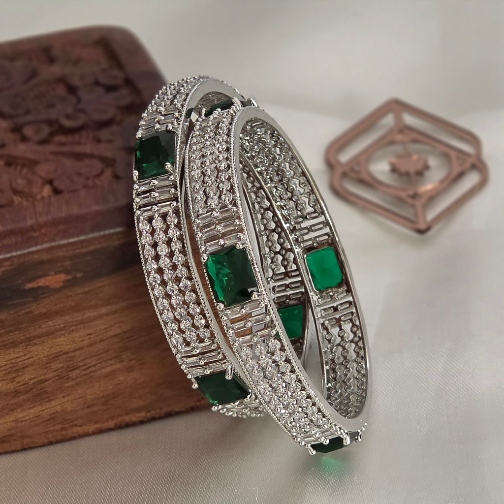 Bangles, set with emerald and white stones. Ahankaraka AKBA45.