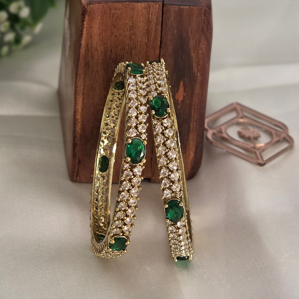 Bangles, set with emerald and white stones. Ahankaraka AKBA39.