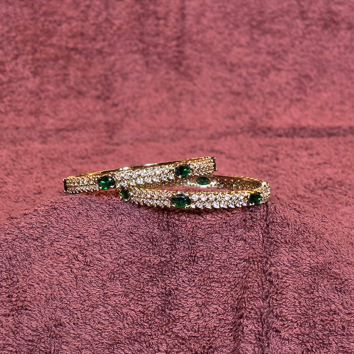 Bangles, set with emerald and white stones. Ahankaraka AKBA39.