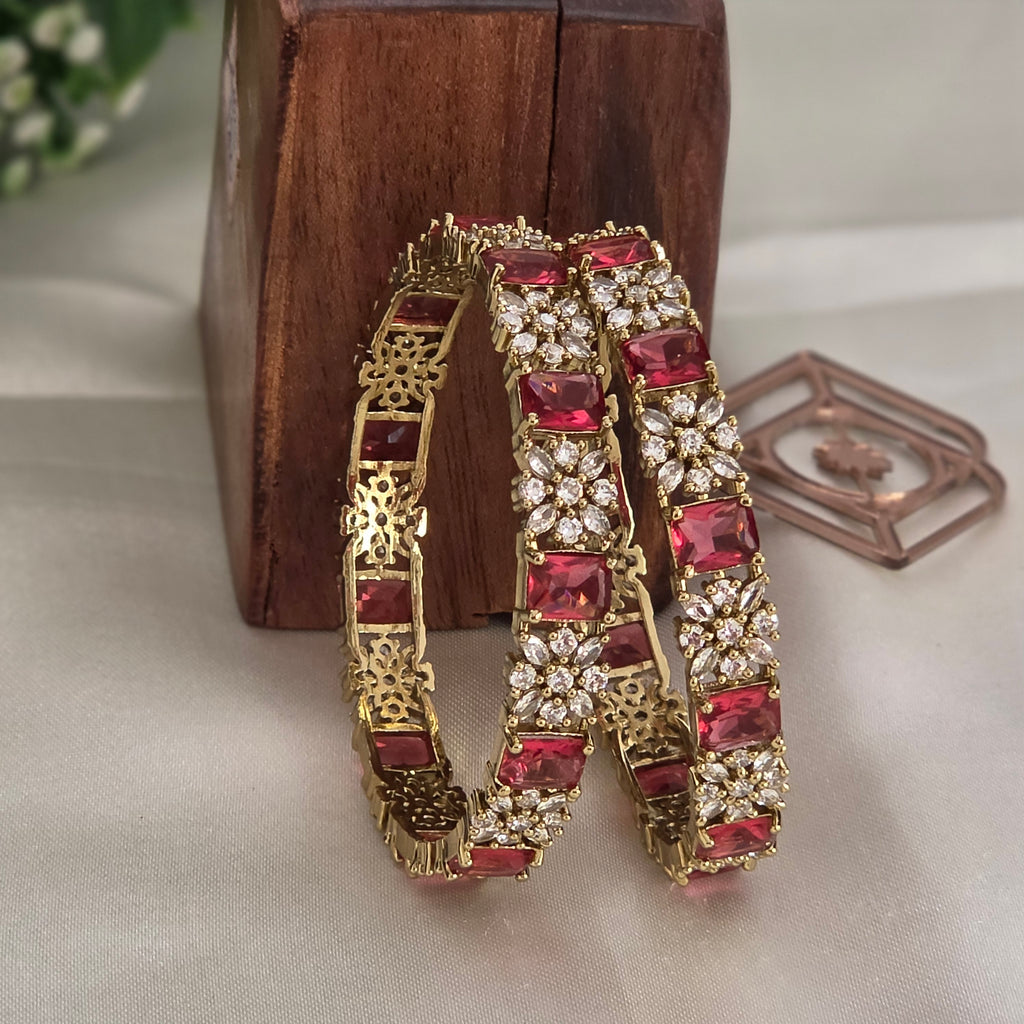 Bangles, set with ruby and white stones, floral motif. Ahankaraka AKBA42.