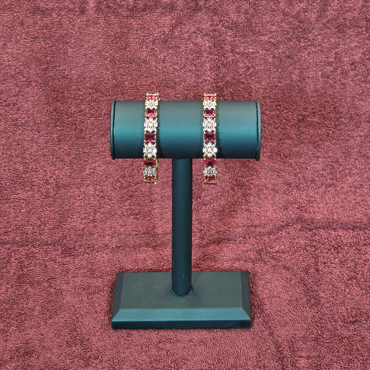 Bangles, set with ruby and white stones, floral motif. Ahankaraka AKBA42.